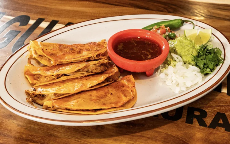 Crispy birria tacos with consommé